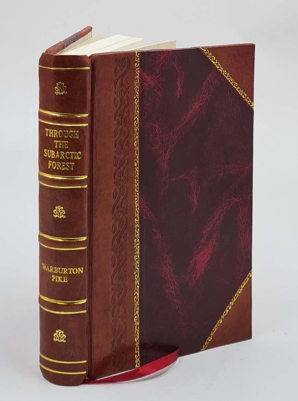 Through the subarctic forest A record of a canoe journey from Fort Wrangel to the Pelley lakes and down to the Yukon River to the Behring Sizeea 1896 [Leather Bound]