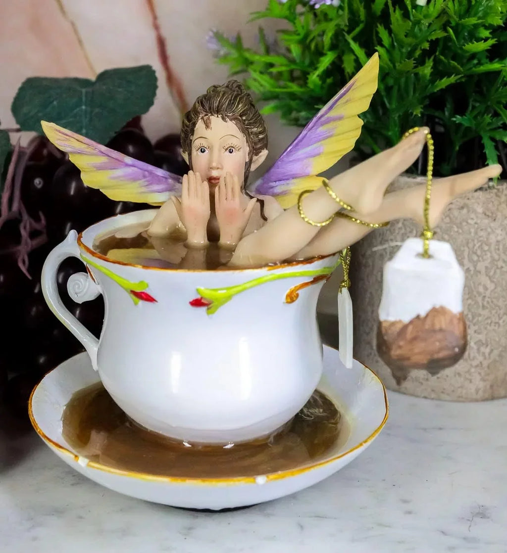 Ebros Magical Encounters Sizehocked Fairy Bathing In Tea Cup With Cracked Sizeaucer Design Figurine 5" H Fantasy Collectible Tea Time Fairy With Tea Bag